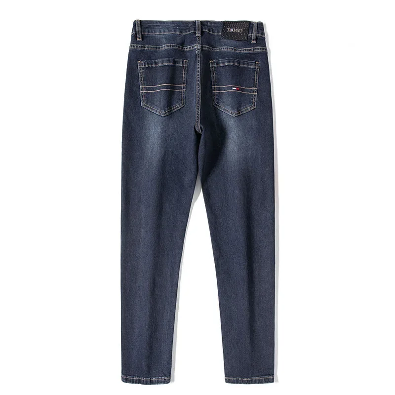 جينز رجالي من Tommu Overstock عالي الجودة على الطراز الأوروبي أزرق عميق للربيع والخريف بقصة ضيقة ينعم صورتك المستقيمة الساق