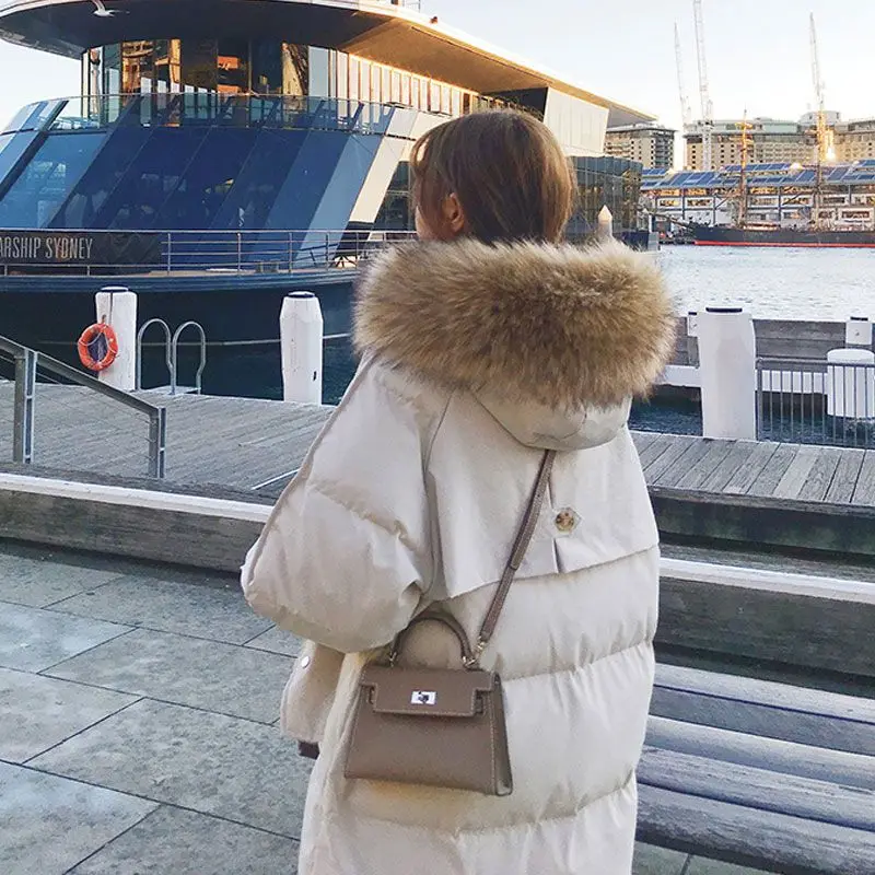 ​ ​ Abrigo acolchado medio largo de invierno 2025 para mujer, Parka con aislamiento térmico grueso de gran tamaño de estilo coreano ​ ​