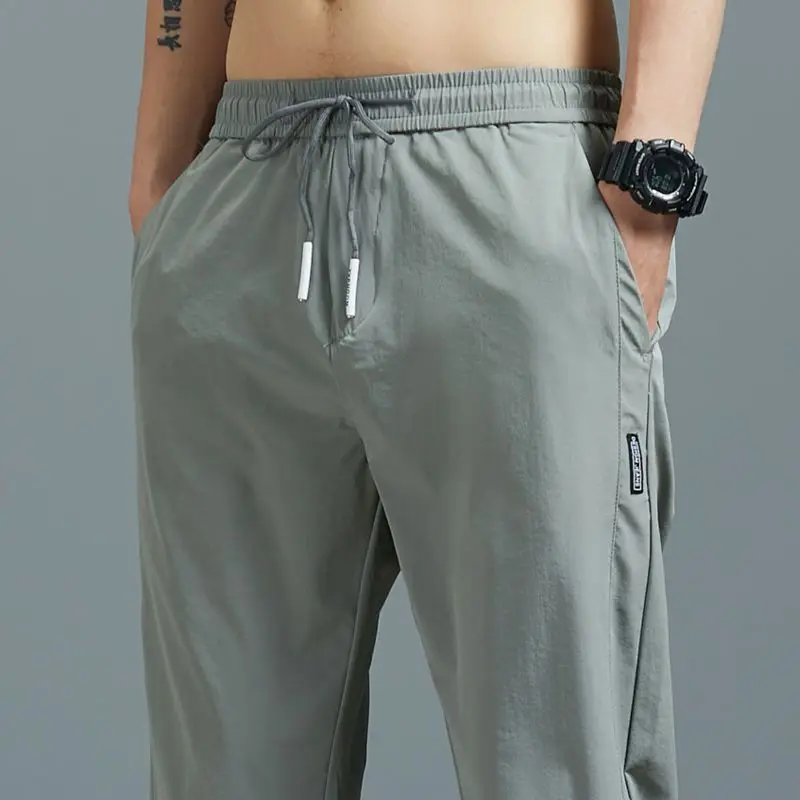 Calça casual masculina de Stretch Joggers, moletom sedoso solto, ginástica ao ar livre, marca de verão, masculina