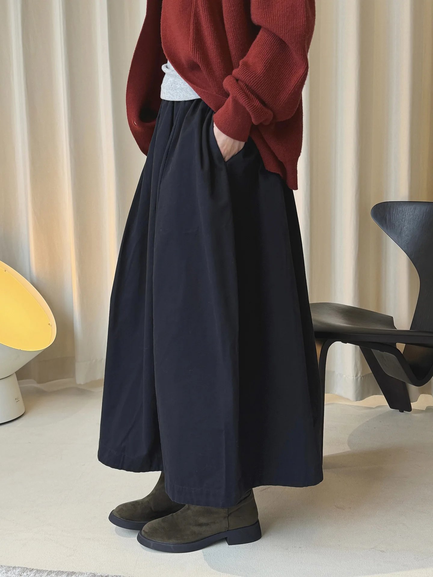 أوائل الربيع بسيطة عالية الخصر زر مرونة نصف تنورة فضفاضة التخسيس تنورة طويلة عادية للنساء