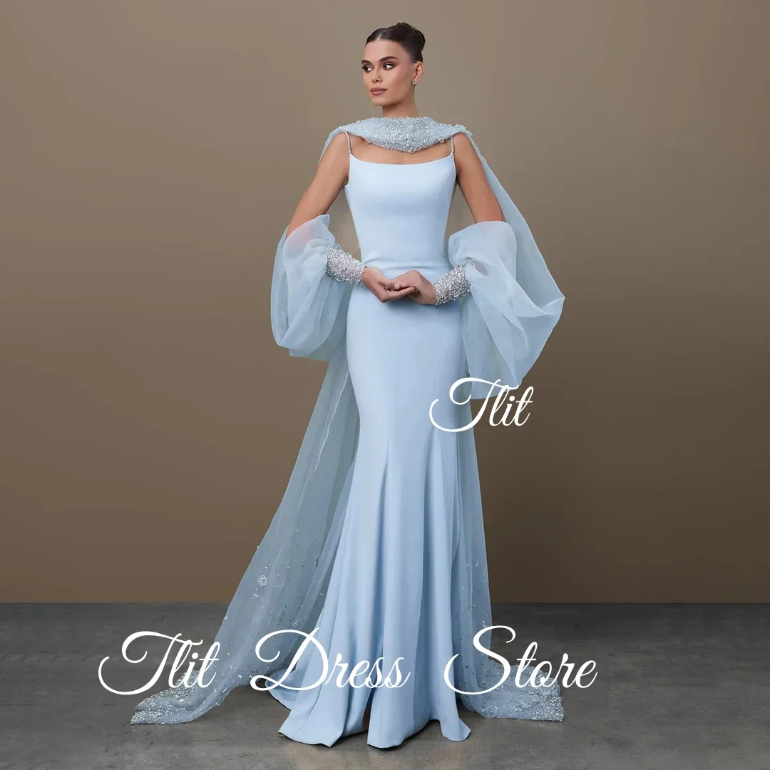 فستان سهرة أنيق من TLIT باللون الأزرق والحرير والساتان حورية البحر مع سترة من التول وأكمام منتفخة وقطار سويب كريستالي مع كريستالفساتين