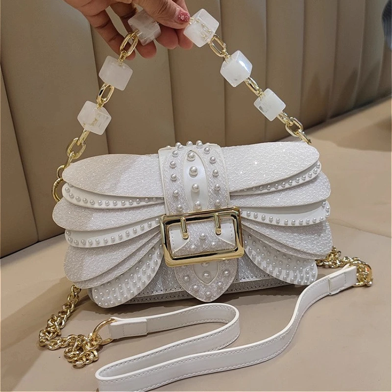 

Leather handbag women's small square bag 2025 new light luxury niche texture pearl rivet wing chain small bag