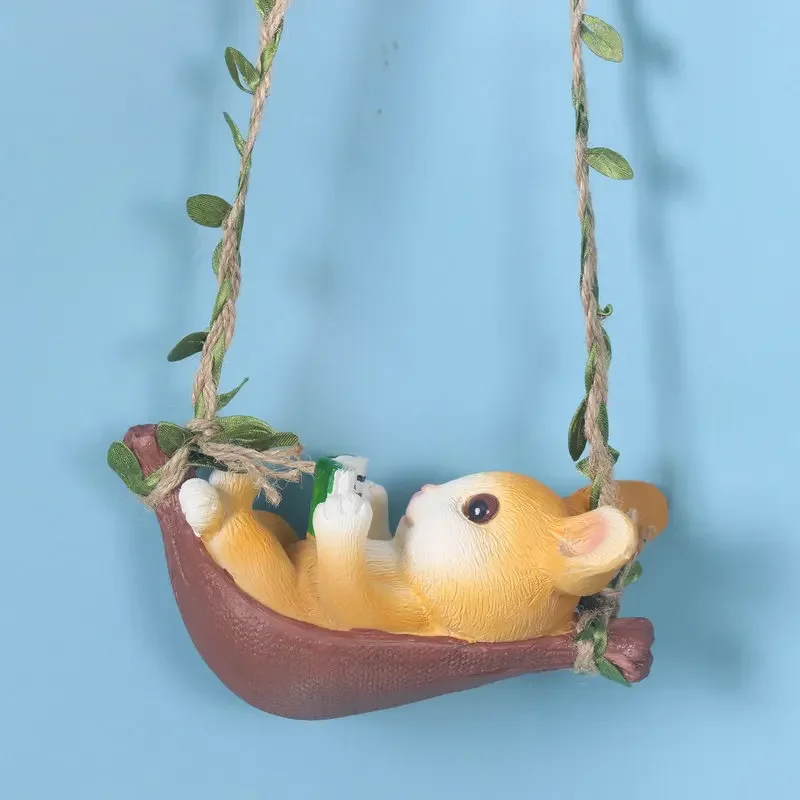 

Cute little rabbit reading, swinging on a swing, garden landscape, courtyard, balcony, window sill decoration, pendant, hanging