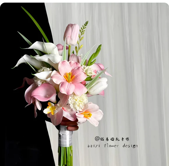 Calla lilies get a certificate. Bride holds pink artificial flowers. Wedding photo props. Wedding artificial flowers are hot.