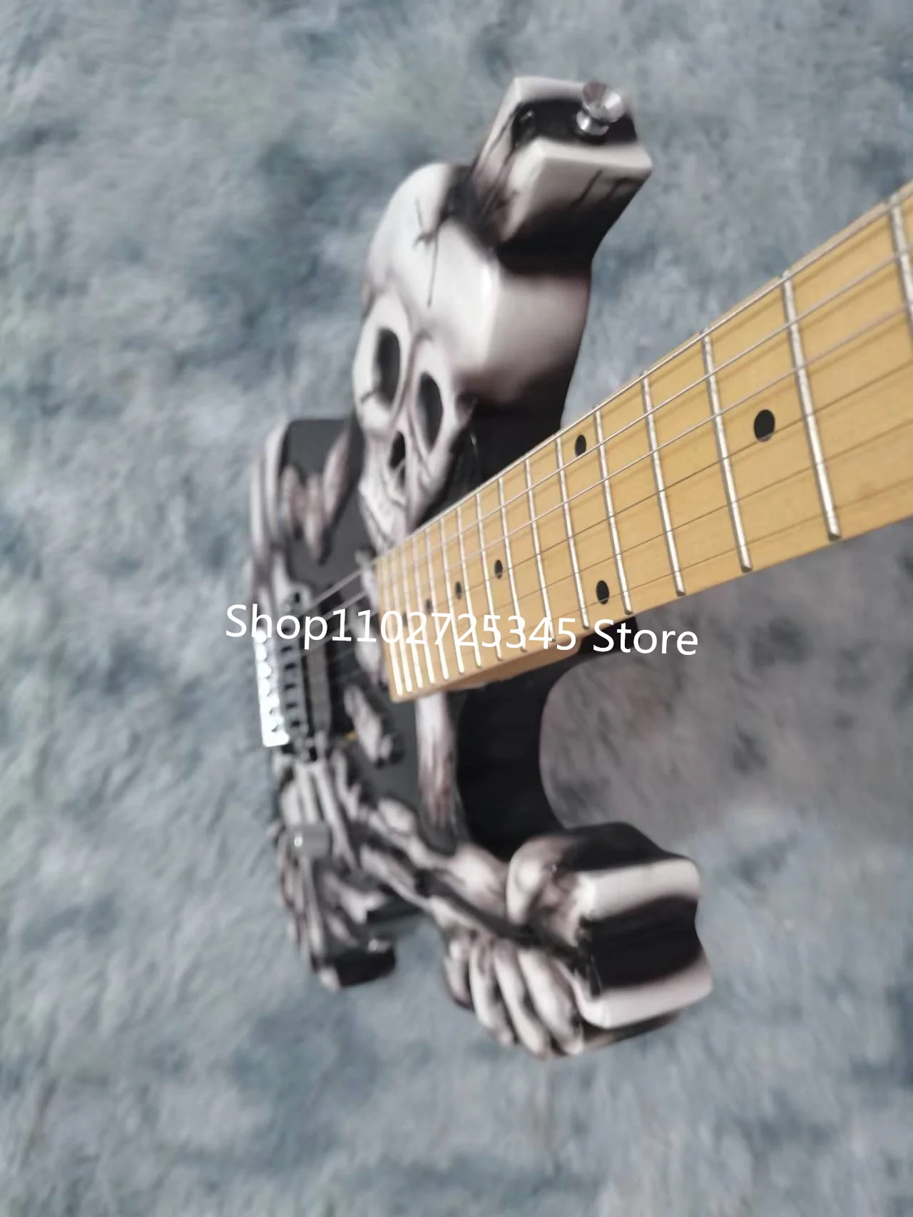 6-string skull electric guitar, maple fingerboard, silver accessories, tremolo system, free shipping