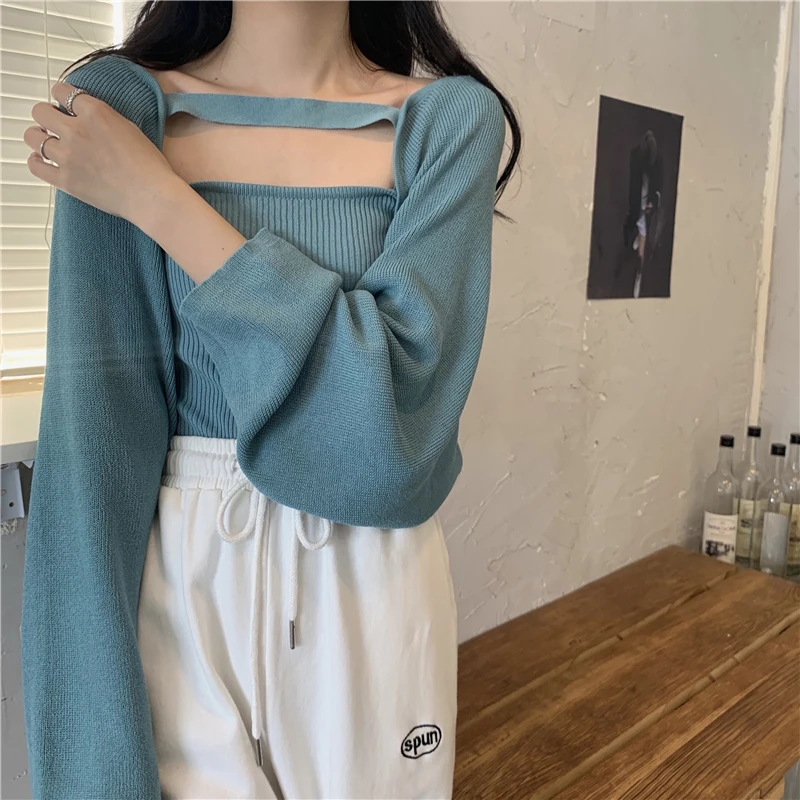 女性のセクシーな不規則なフリル、スタイリッシュなボレロのセーター、若いシックなニットウェア、居心地の良いトリオットシャール、クロップトップ、ソリッドロンパース、秋のファッション