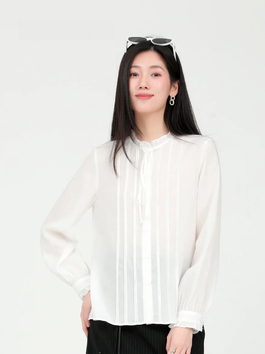 

Рубашка Delanzhi Весна 2026: Новая модель с нежным рюшем по низу, из ткани Lenzing, белая, свободного кроя, во французском стиле, с длинным рукавом и воротником-стойкой, для офиса