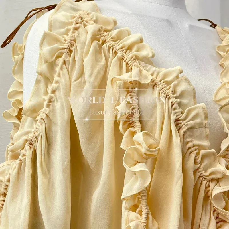 فستان نسائي عالي الجودة موديل 2025 أنيق أصفر مكشكش وأكمام طويلة غير متماثل