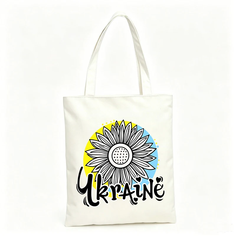 Women's sunflower graphic canvas tote bag with handwritten text, ideal for casual shopping and daily use