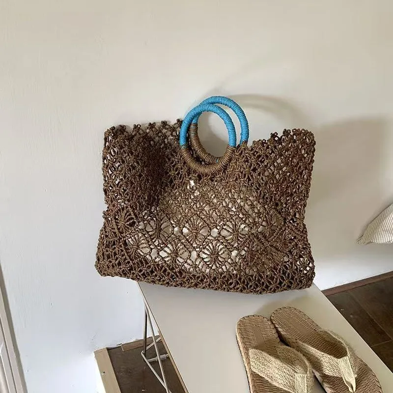 

New small niche versatile straw bag hollow handwoven bag summer beach tote for women