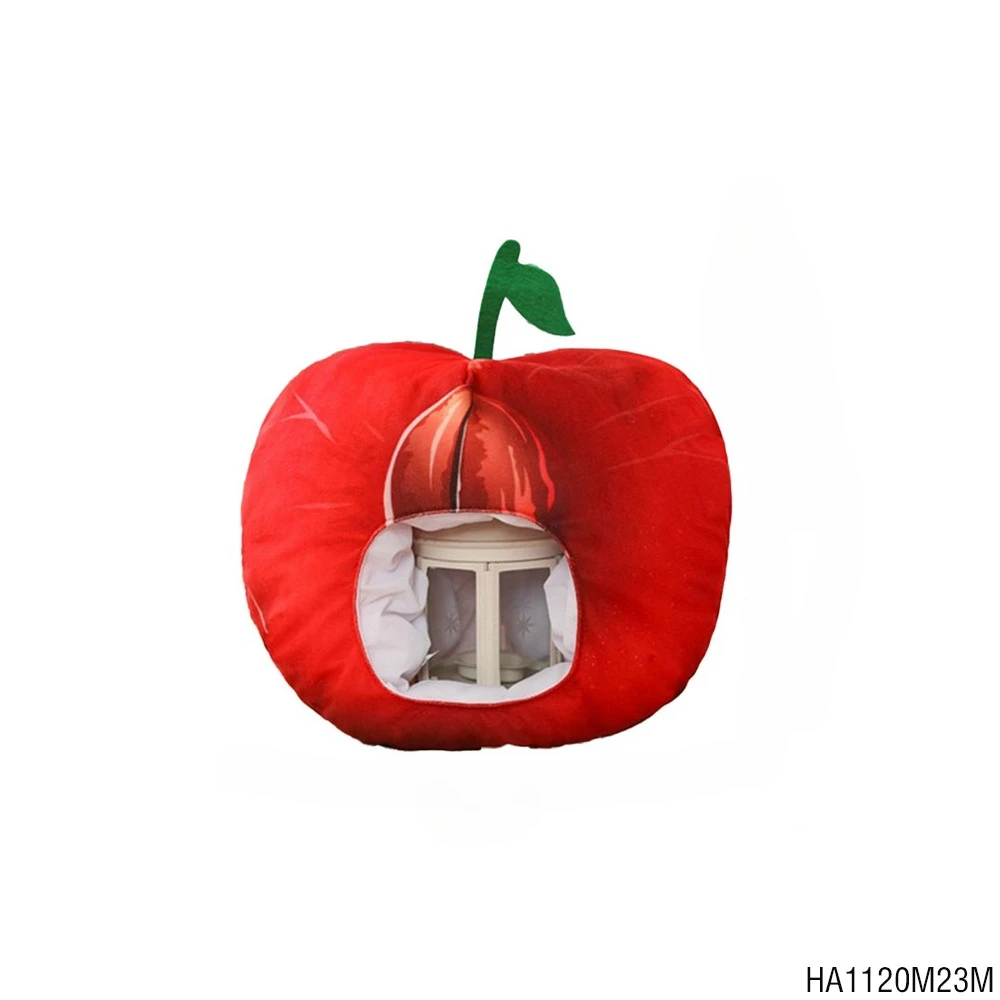 

PESENAR This is a red apple shaped wacky headgear with green fruit stalk blades and a round opening on the front for parties