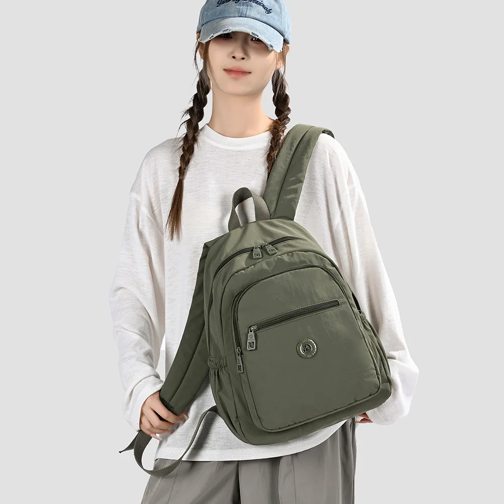 Women's Olive Green Backpack with Front Multi-Pockets Lightweight Nylon Casual Daypack with Round Logo Badge for Daily Travel