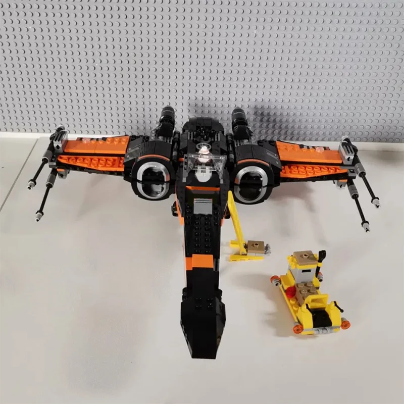 717 ชิ้น สินค้าใหม่ในสต็อก ชุดตัวต่อโมเดลยานอวกาศ X-wing Fighter ของโป สงครามอวกาศ ของเล่นตัวต่อประกอบเอง ของขวัญสำหรับเด็กผู้ชายและผู้ใหญ่