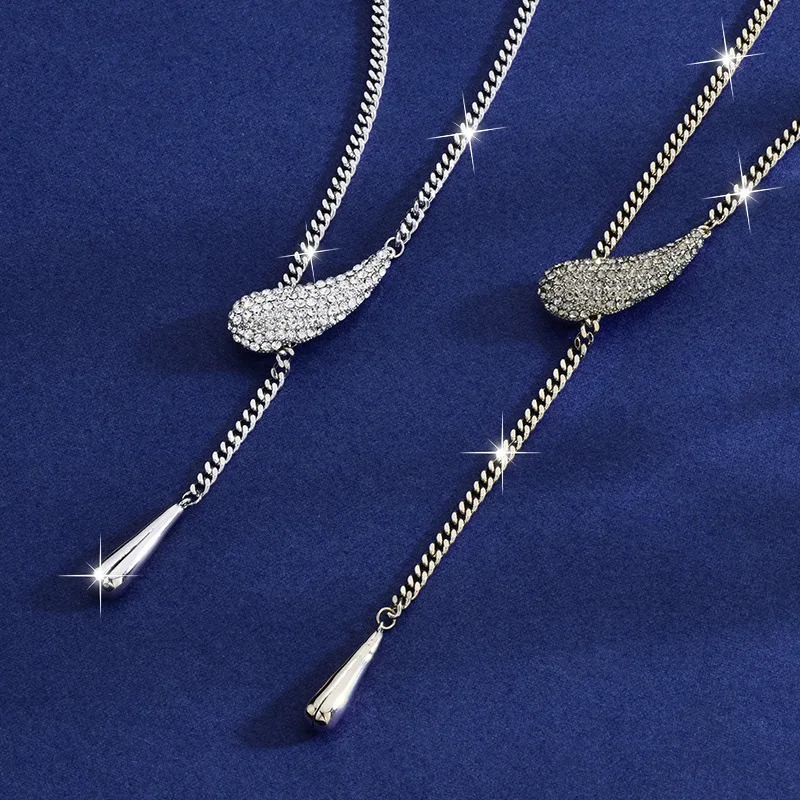 

Brand-new teardrop titanium steel necklace, a light luxury for ladies, with a teardrop tassel sweater chain pulled out