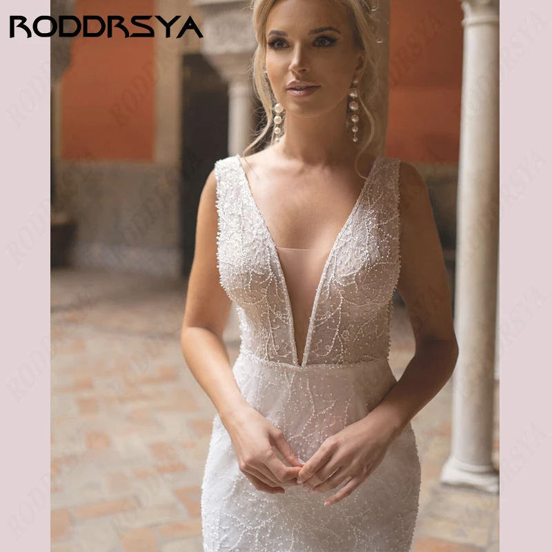 فستان زفاف بحورية البحر من RODDRSYA برباط على شكل حرف v عميقة بدون ظهر Vestido De Novia طول الأرض فستان زفاف على الشاطئ بدون أكمام لحفلات العروسبرباط على شكل حرف v عميقة بدون ظهر Vestido De Novia طول الأرض فستان زفاف ع