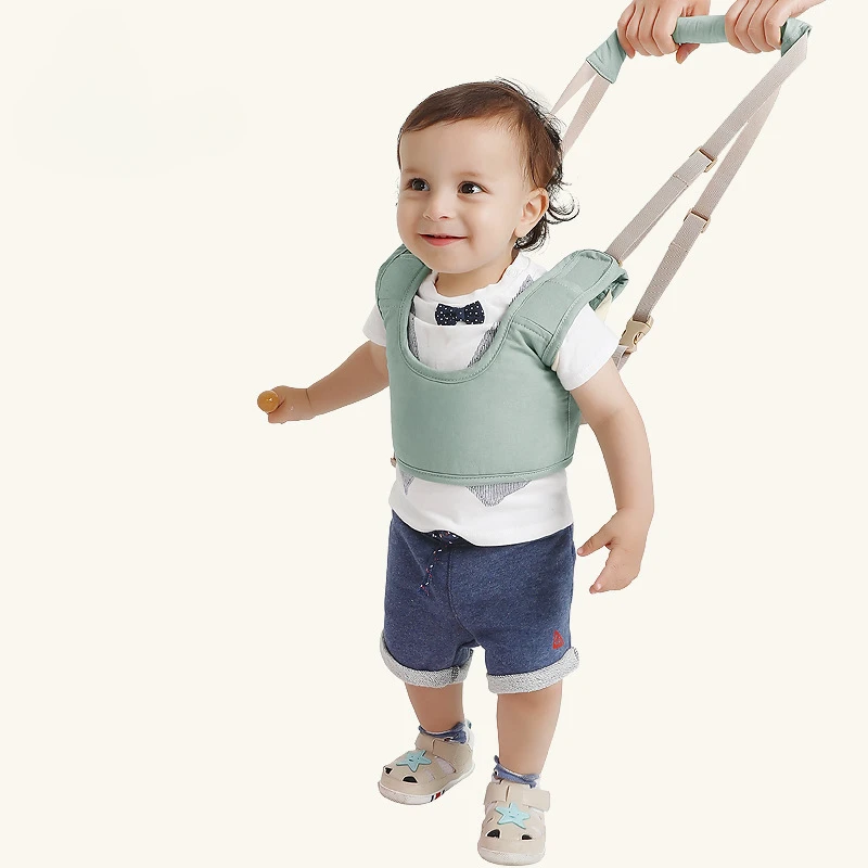 A baby walking belt with a carrying basket style children's walking belt. Baby learning to walk safety belt