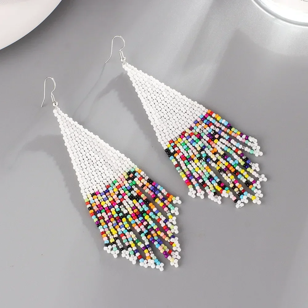 

Beaded earrings Tassel Random string Irregularity Hand knitting Bohemia Alloy Tide Female Simple Rice bead earrings