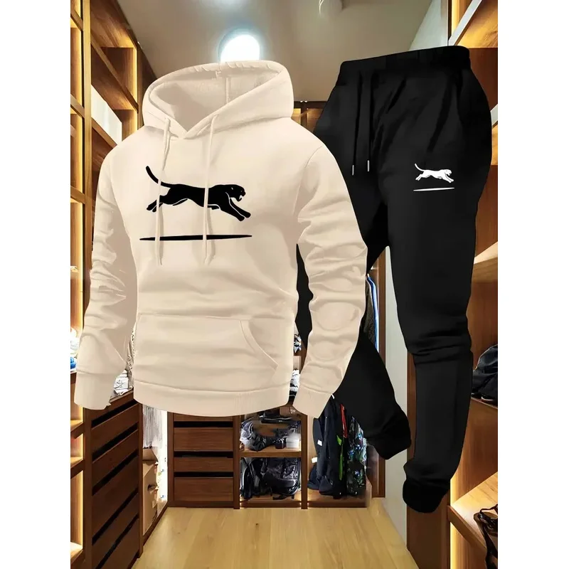 Zestaw dresowy: bluza cargo i spodnie typu jogger, czarno-biały wzór w panterkę, miękki i wygodny materiał, luźny krój, bluza z kapturem, wiele kieszeni.