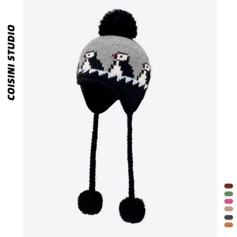 Gorro de punto con protección para los oídos de Jacquard de pingüino de dibujos animados coreano para hombres y mujeres, gorros de bombardero con cordones y bolas de pelo cálidas para invierno