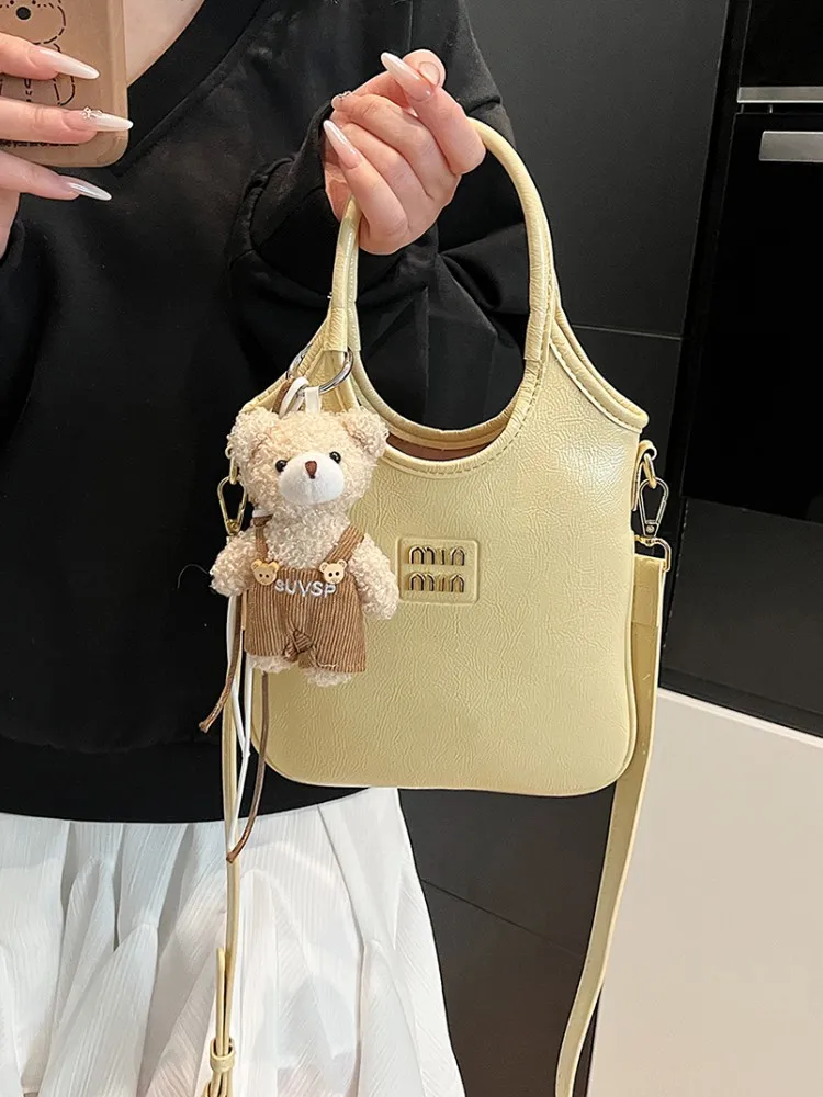 

Luxury designer summer fashion simple niche casual portable small backpack sense commuting to work all-match messenger bag women