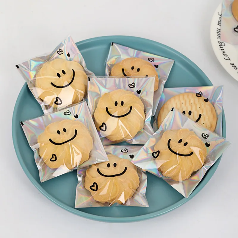 100pcs Cute Smiling Face Cookie Packaging Bag Laser Transparent Biscuit Bag Self-adhesive Bag Birthday Party Wedding Decoration