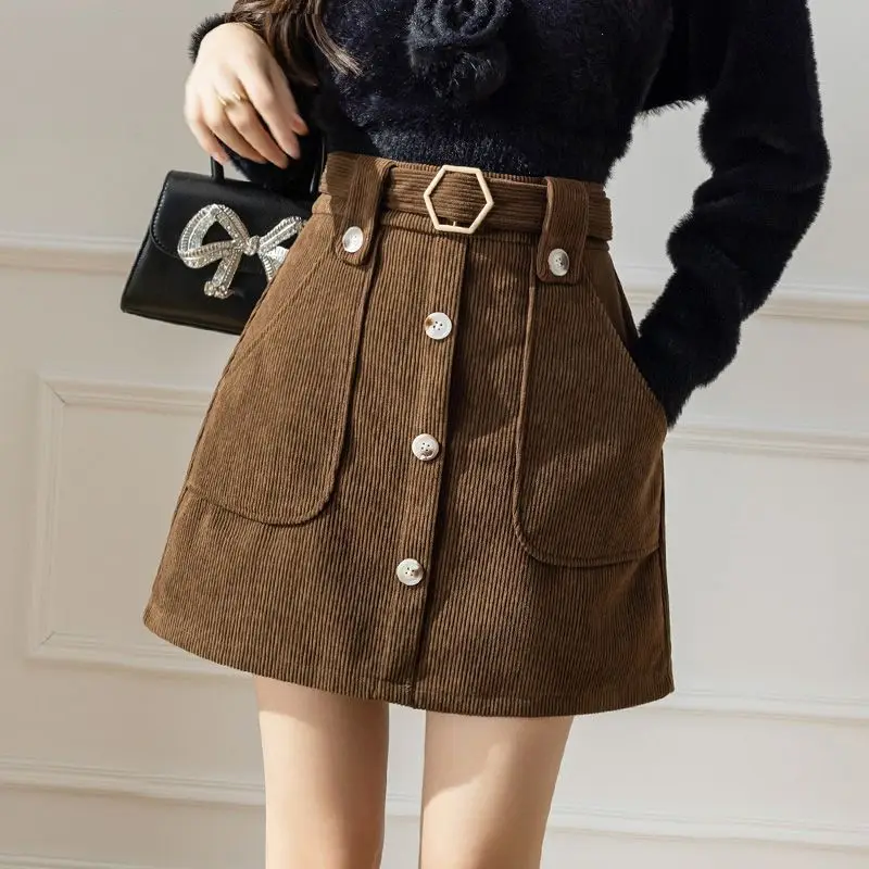 Retro corduroy midi skirt for women's spring wear 2024 Korean  new item, slim  high waist A-line wrapped hip short skirt