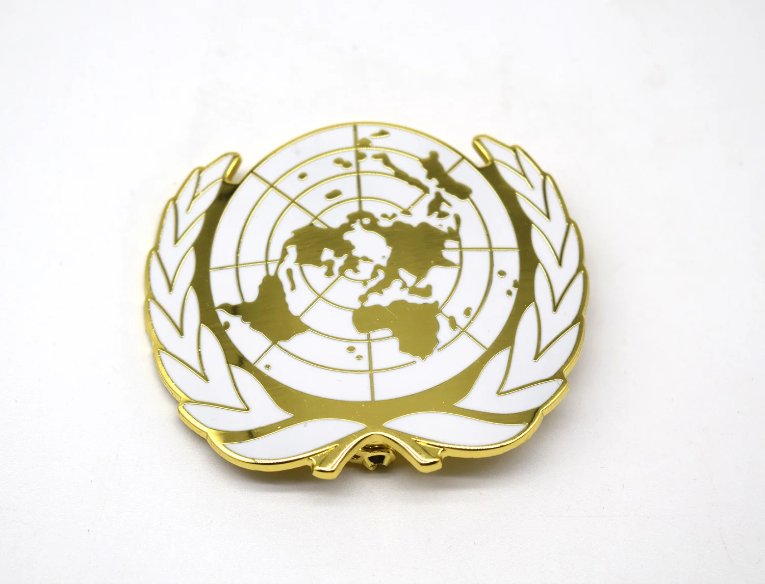 

United Nations Peacekeeping Force UN BLUE BERET Hat Badge UN Gold Badge