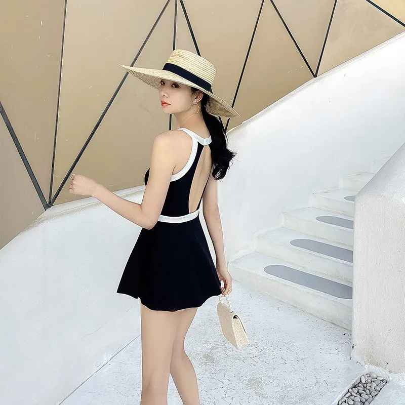 Minsu ชุดว่ายน้ําวันพีซสไตล์เกาหลีสําหรับผู้หญิงฤดูร้อนน้ําพุร้อนแบบอนุรักษ์นิยมกระชับสัดส่วนหน้าท้องครอบคลุม 2025 ใหม่สีทึบ Skir