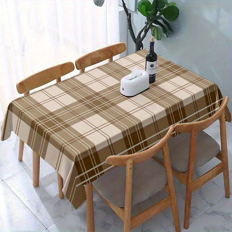 One piece of brown and white checkered vintage tablecloth. Rectangular tablecloth with classic check pattern design.