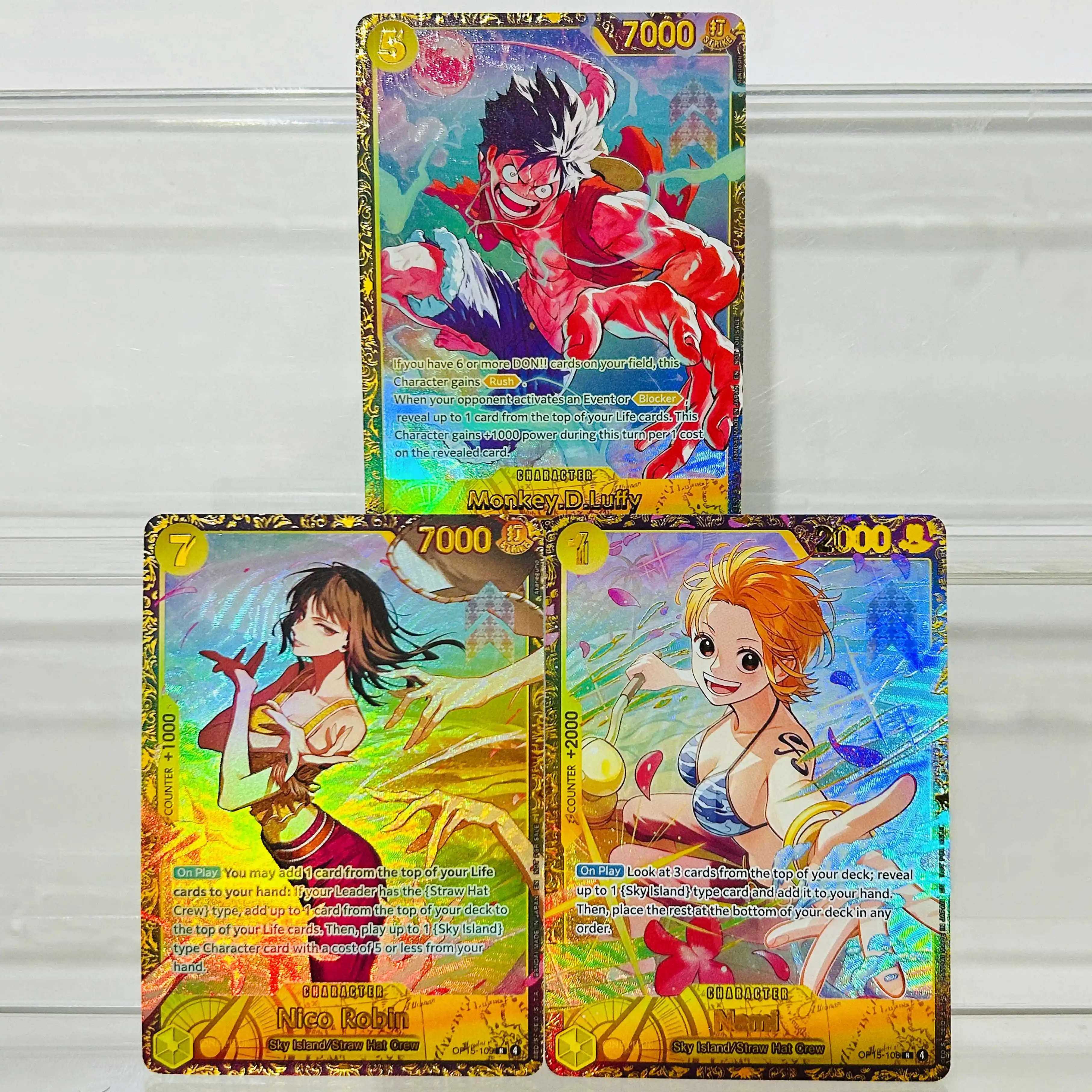 One Piece Luffy Nico Robin Nami 3-teilige Folien-Textur DIY-Karten Englische Version Sammlerqualität Premium Anime-Sammelkarten