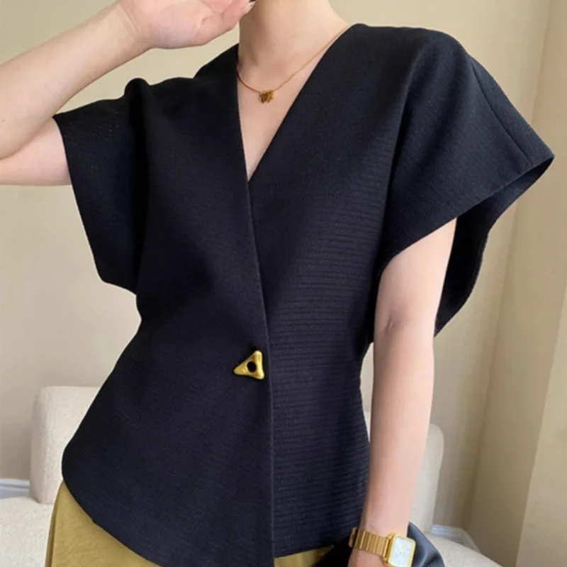 

A Slim-fit Blouse with A French-style Asymmetrical Suit, with Dropped Shoulder Sleeves and A Vest-like Jacket.