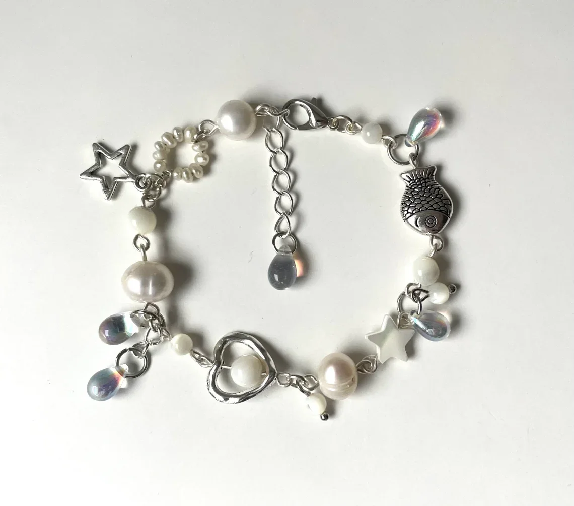 wave to earth bracelet | flaws and all | handmade beaded bracelet | white jewelry | w2e merch