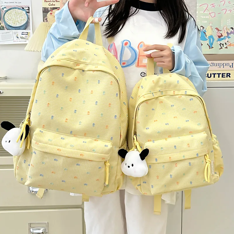 

Minimalist Yellow Backpack For Women Durable Casual Rucksack With Dog Charm & Pocket Detail