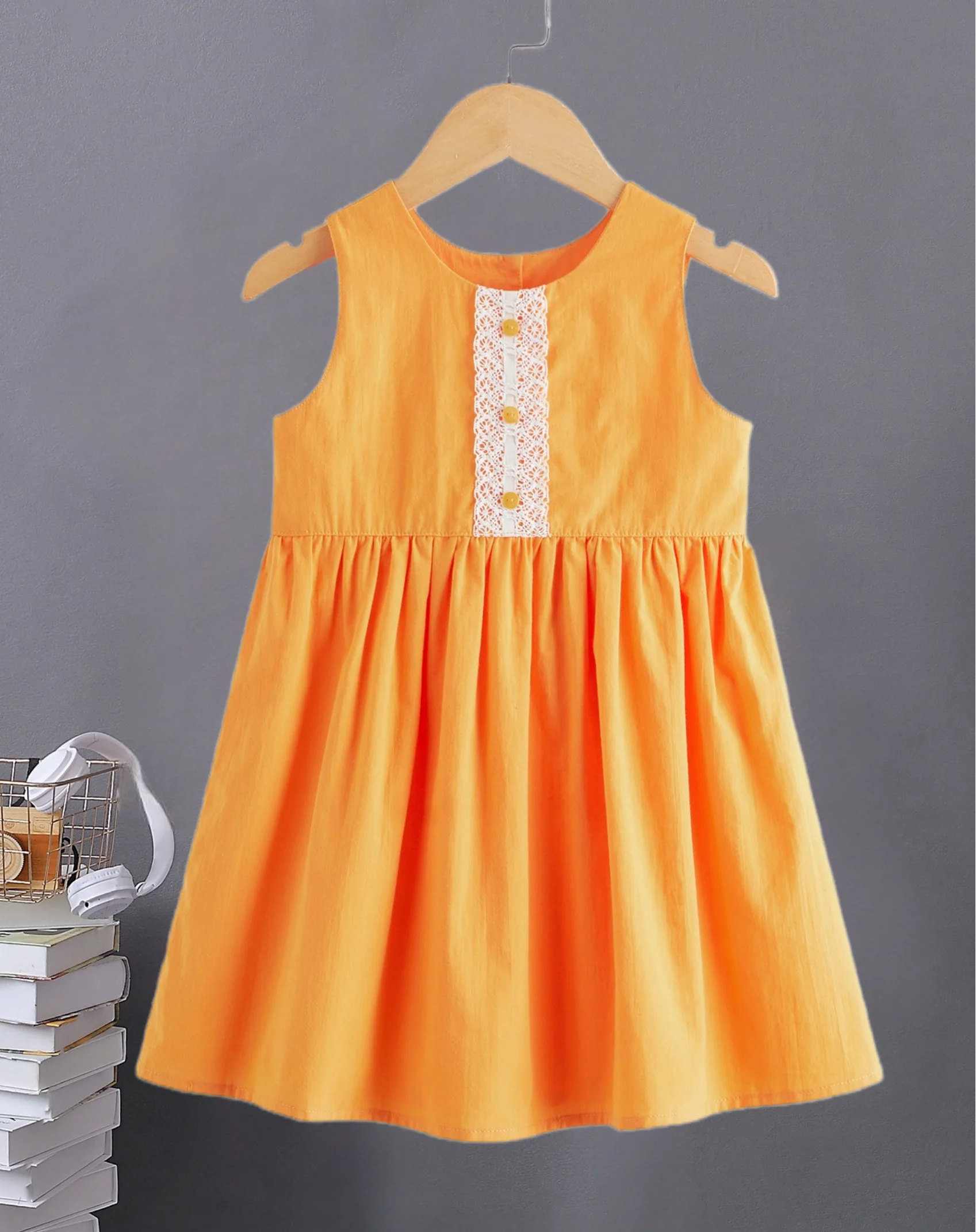 Bright orange girls sleeveless dress - lace decorative button design