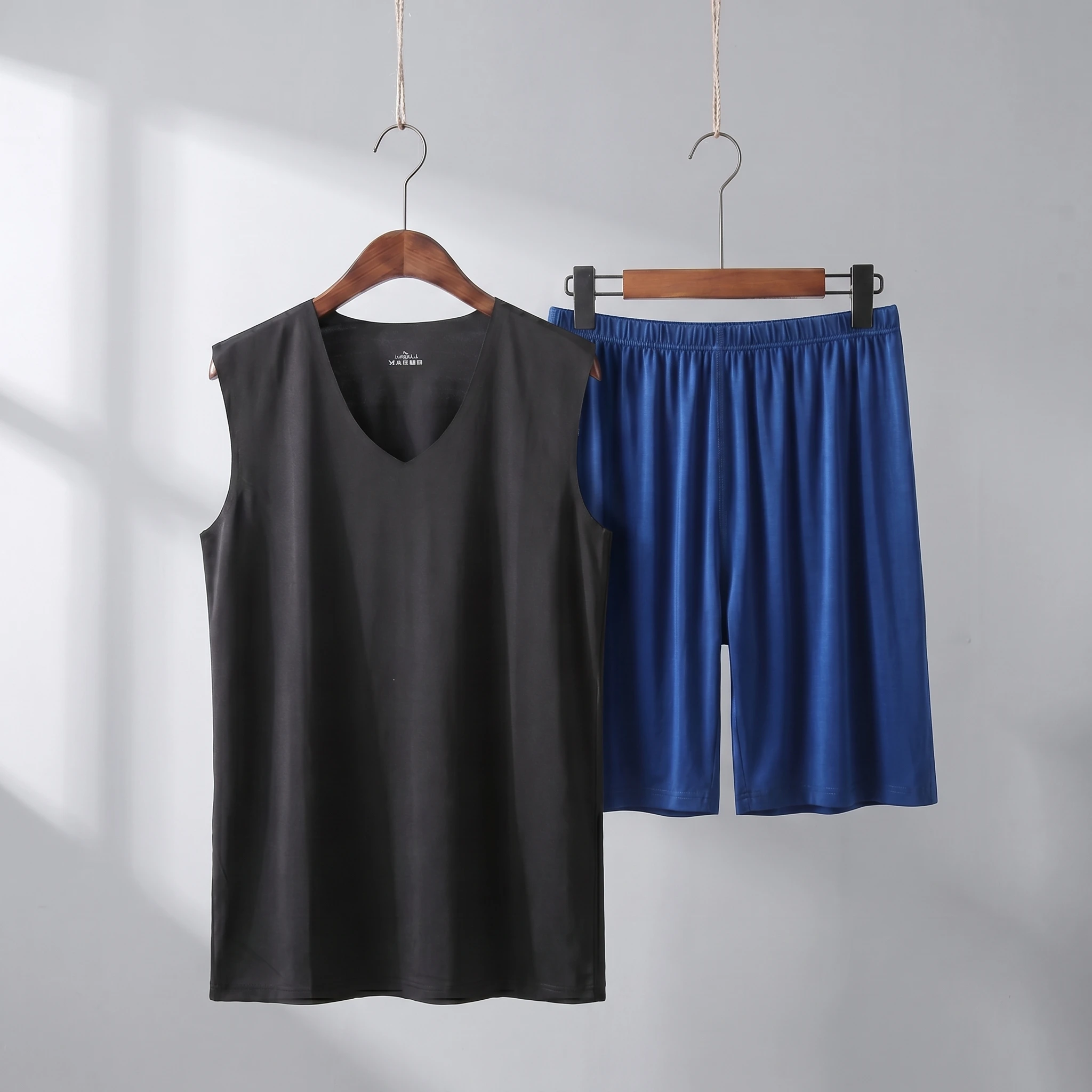 Black vest + dark blue shorts