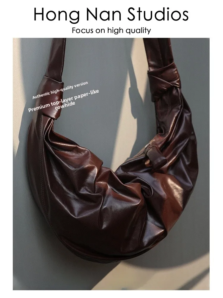 

Upaded Version 2025 Summer Season HNS Paper Feel Cowhide Dumpling aped Handbag Soft Handle Briti Sle ex Bag