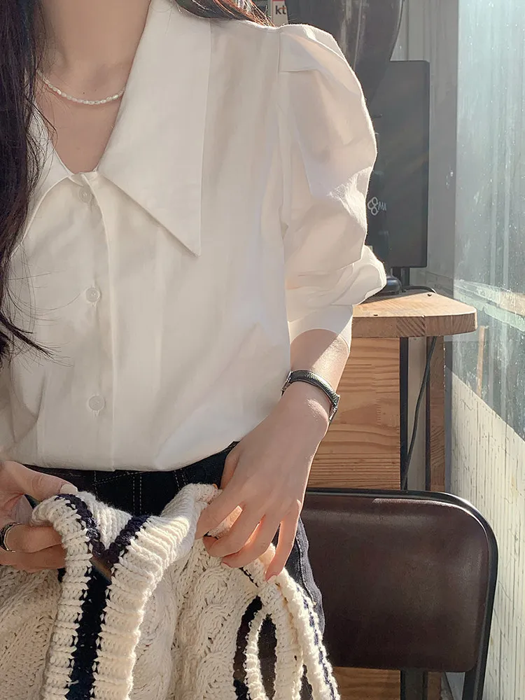 

White Shirt Women's Design Sensation Small Audience Fashionable Sharp Collar Bubble Sleeve 2026 New Spring Polyester Fiber