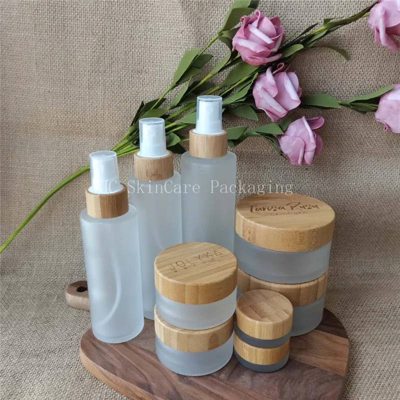 

High Quality Fancy Frosted Cosmetic Cream Glass Jar Cosmetic Packaging Eco Friendly Bamboo Cosmetic Jars body butter cream jar