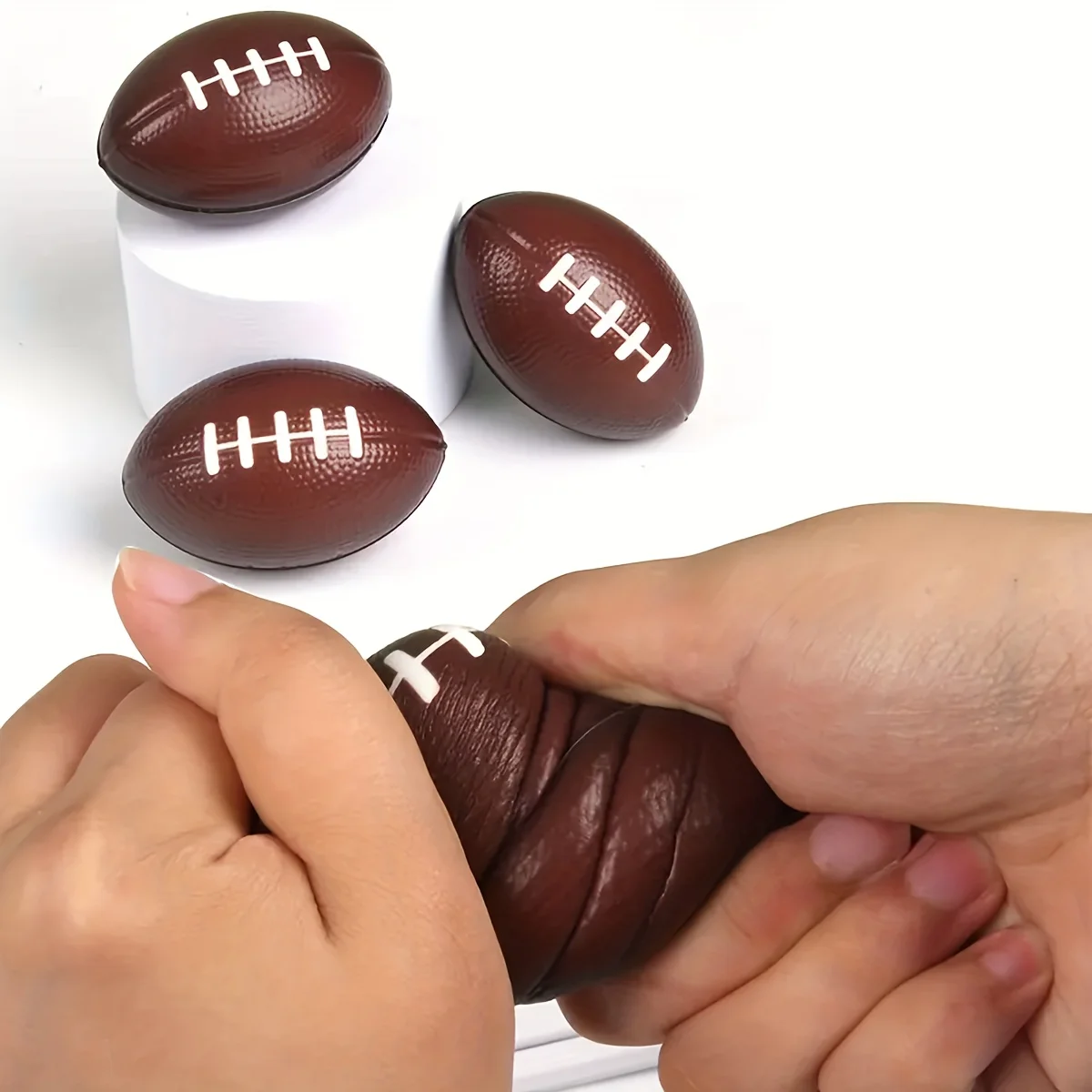 Elastischer Dekompressions-Griffball, Entlüftungs-Squeeze-Ball, American-Football-Zubehör, Kaffee-Rugby-Ball, Spielzeug zur Stressabbau