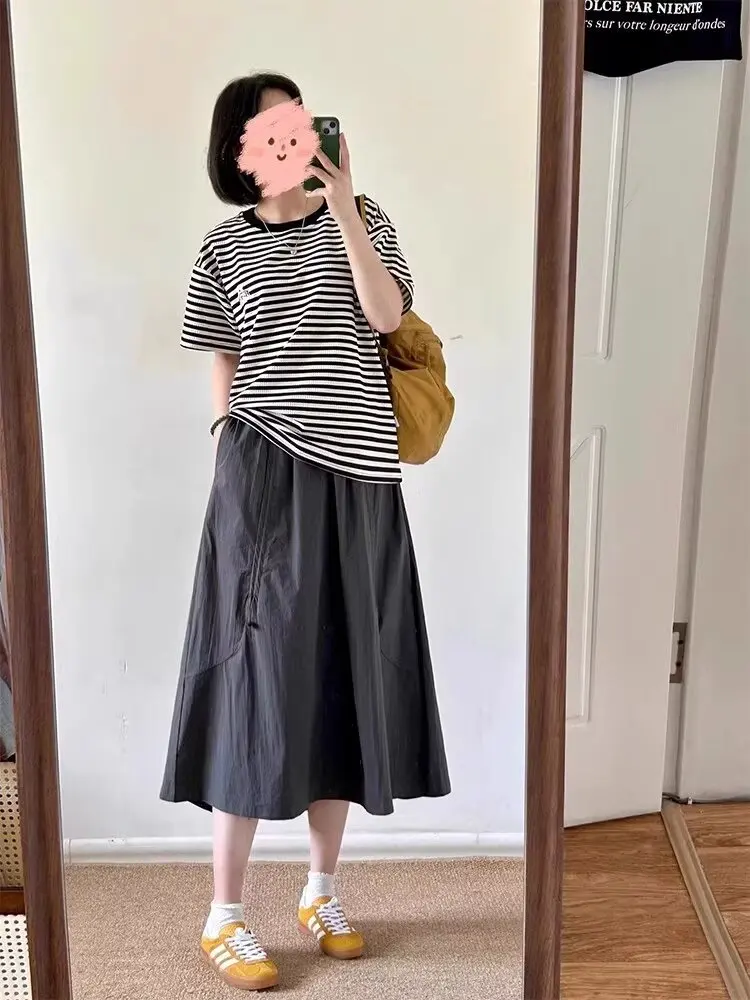 Femme nouveau dans les vêtements a-ligne taille haute décontractée minceur gâteau jupe polyvalent mi-longue robe douce noir jupe longue tout-match