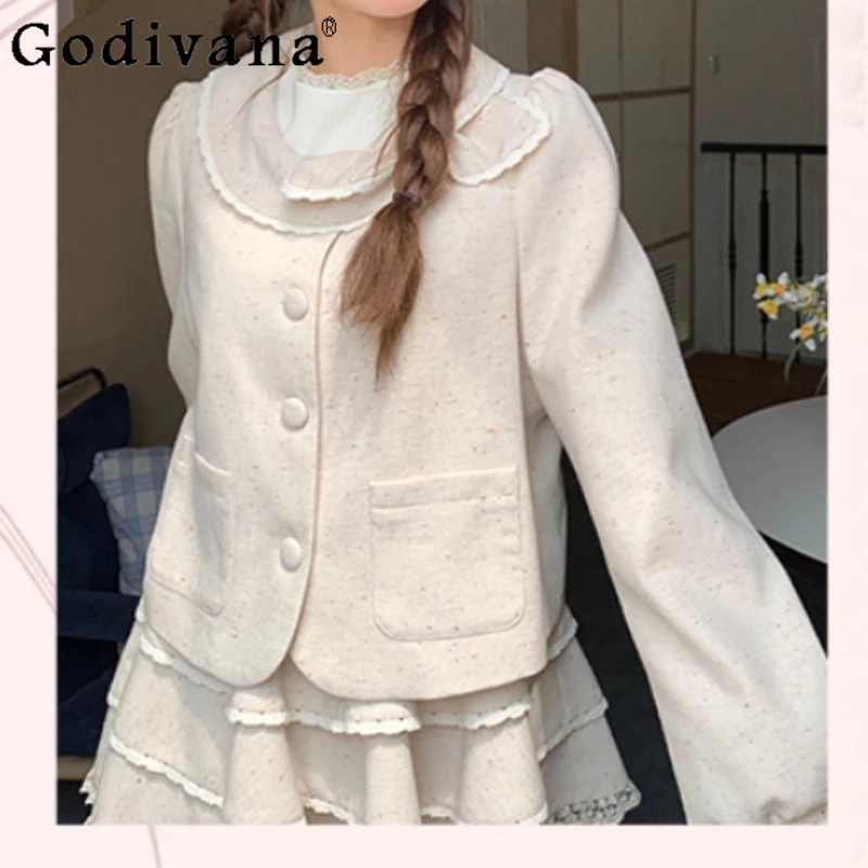 Otoño Invierno nuevas mujeres agradable arco blanco roto lindo cuello Peter Pan Chaqueta corta moda reductor de edad versátil Top de manga larga