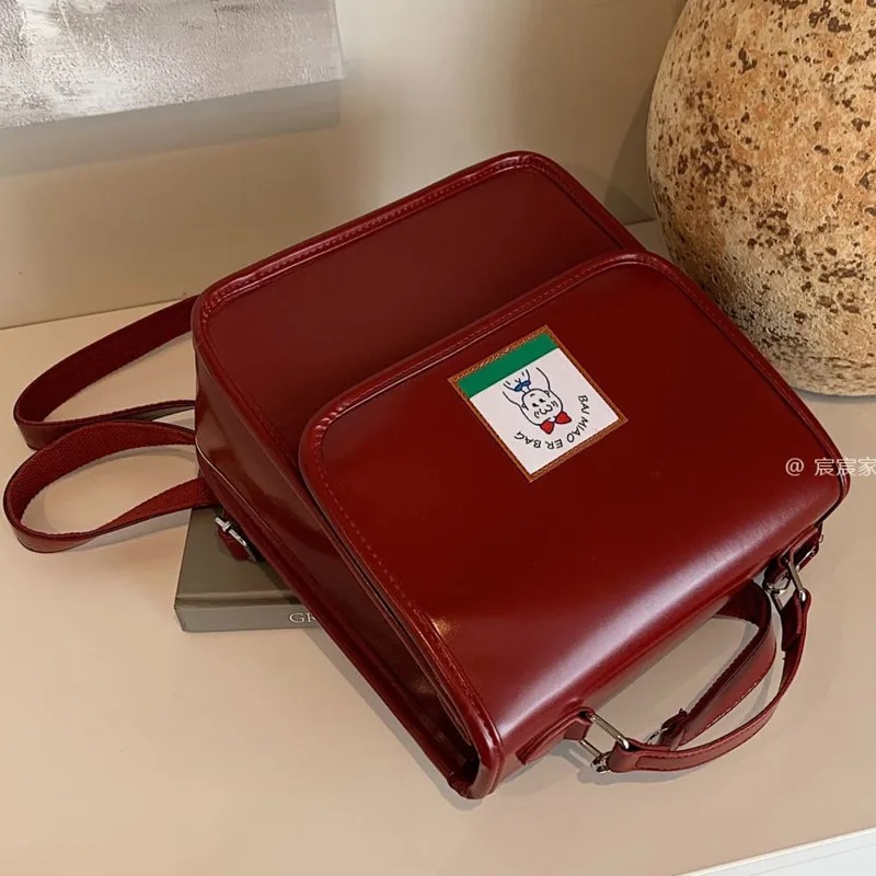 Karikatür görüntü sırt çantası 2024 yeni japon kore PU kolej çantası gidip Tote çanta omuz Crossbody çanta büyük kapasiteli okul çantası