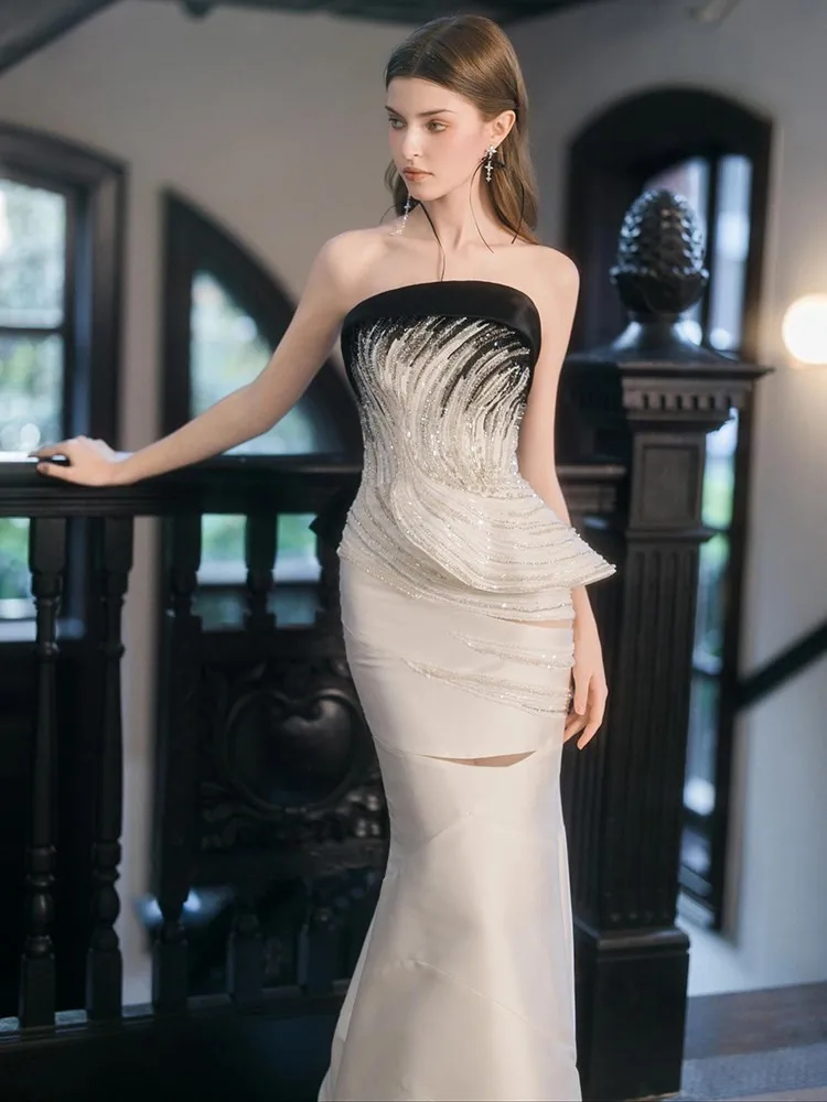 A new strapless satin light fishtail style dress for banquets