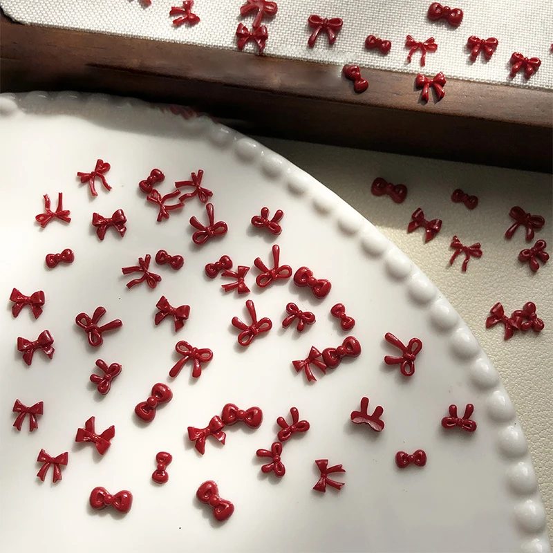 100PCS 3D Nail Art Fiocco rosso Pendenti e Ciondoli Forniture Kawaii Accessori Resina Per Unghie Decorastion Prodotto Manicure Decor Materiali Strumento