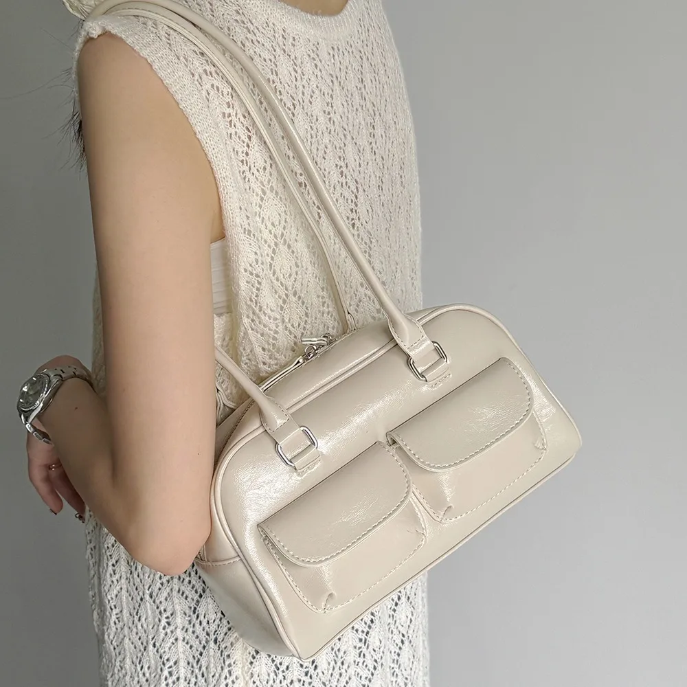 

Новая нишевая сумка в стиле ретро под мышками большой вместимости и небольшим карманом.