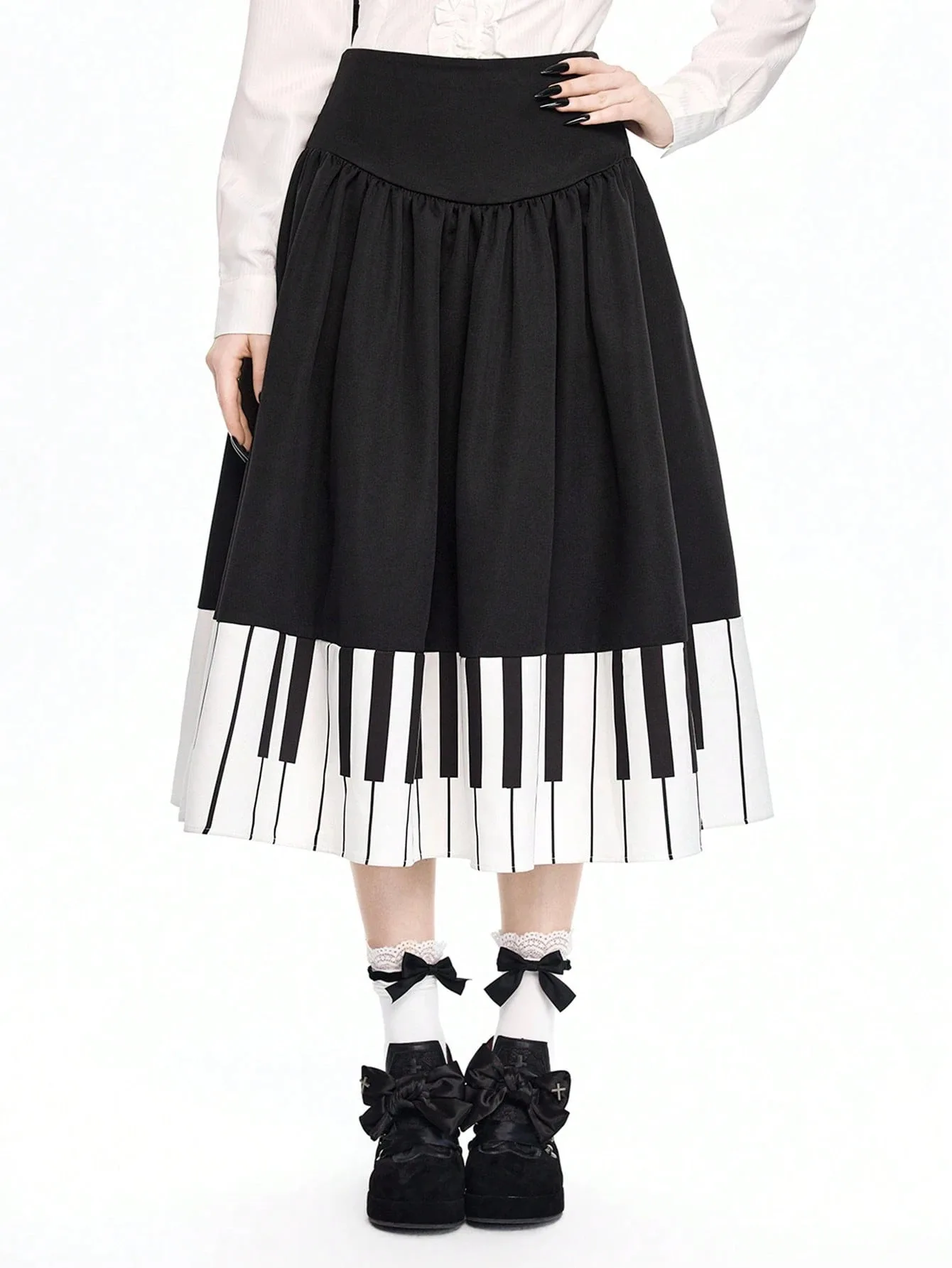 

Французская трансграничная новинка весенне-летнего сезона: черная юбка миди с высокой талией и декоративными вставками в виде клавиш пианино, художественная нишевая модель для женщин.