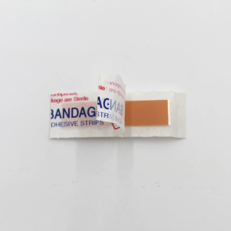 Mini PE Band Aid descartável, pequeno remendo de molho para feridas, emplastros adesivos, remendos de primeiros socorros, fita Woundplast, 4x1cm, 50Pcs por conjunto