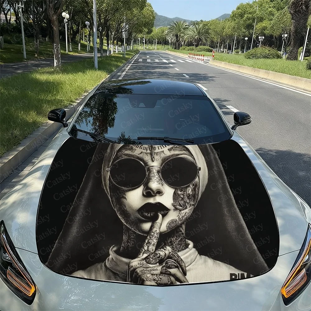 

Stylish car hood sticker featuring a tattooed figure with sunglasses and a shushing gesture. Perfect for unique vehicle decor.Ca