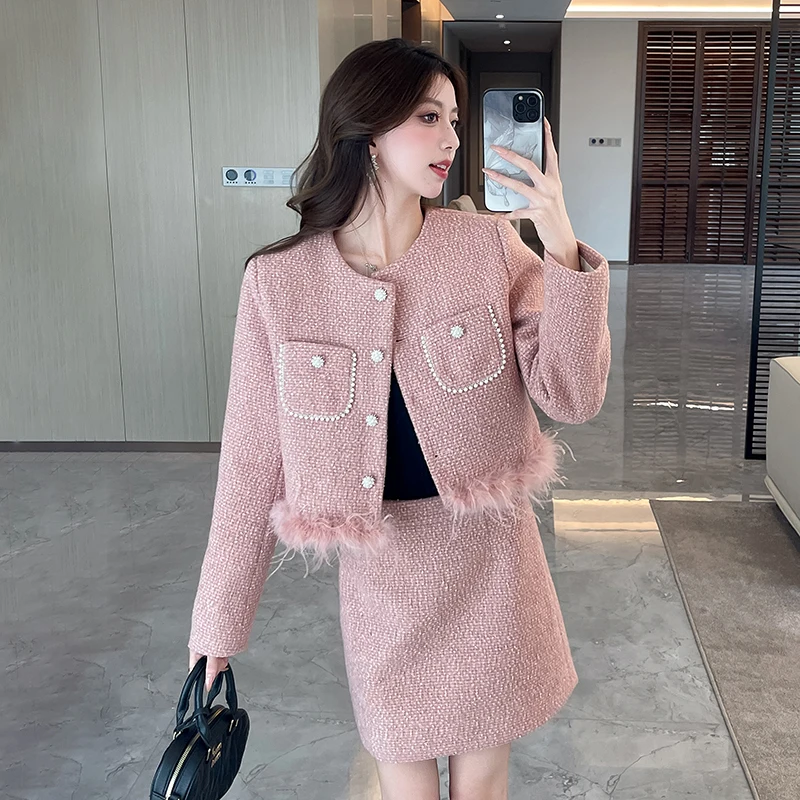 High-end licht luxe gewatteerd dameskostuum herfst en winter roze leeftijdverminderende jas top a-lijn rok dame tweedelige set