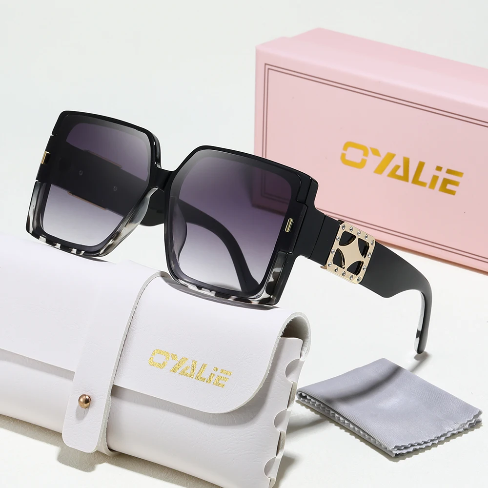 Oyalie Fashionable Large Square Sunglasses Feature a Stylish Square Frame Design, and the Frames Come in Various Colors, Adding a Wild and Fashionable Touch. At the Same Time, It Adds an Elegant Touch to the Wearer. The Metal Decoration at the Temple Pieces of the Glasses Is Exquisitely Designed, Enhancing the Overall Sense of Luxury.